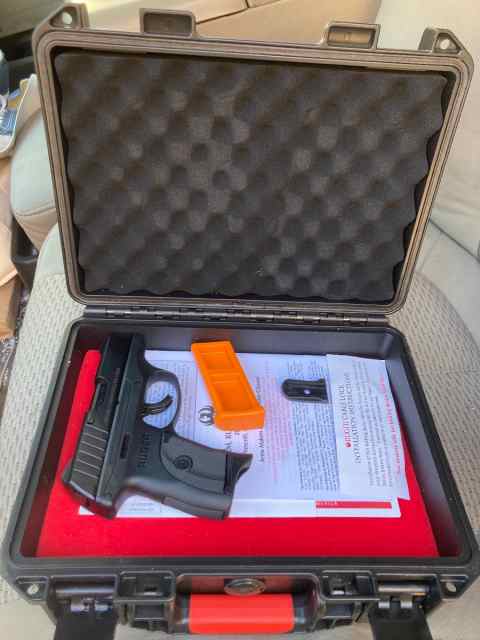 9mm Ruger hand gun w/ gun case, holster, and ammo