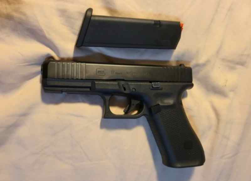 Glock 17 9mm with some slight finish wear.